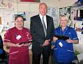 Chief Executive Michael McCourt with Shelley Harrison (left) and Sam Kerr (right) from Woodside A district nursing team in Middleton