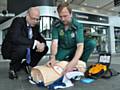 Dr Jon Lamonte, Chief Executive of Transport for Greater Manchester, with David McNally, Community Resuscitation Manager for the North West Ambulance Service NHS Trust