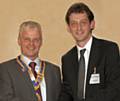 Bob Chadwick, Rochdale Rotary Club’s 88th President, receiving the Rotary Badge of Office from Immediate Past President Neil Helliwell