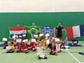 Junior World Cup players at Hopwood Hall College with Hopwood Hall College staff helpers.  Tom Conroy, Hopwood Hall College football development manager is second from the right on the back row