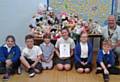 President of Middleton Rotary Club, Keith Trinnaman, presenting children at Parkfield Primary School with their Charter Certificate for forming a Rota Kids Club at the school
