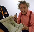 Ken Dodd signing Jimmy’s replacement set of concrete wellies at the Spa Theatre in Bridlington