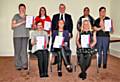 Leader of the Council, Councillor Richard Farnell (centre) presents certificates to successful Restore course graduates