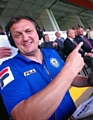 Rochdale AFC's Stuart Ashworth points to Sir Alex Ferguson sat watching in the Spotland stand