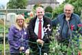 Local councillor Richard Farnell gets dug in with volunteers Ruth Sillence and Brian Yates