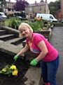 Lesley Stott planting at the gardening event