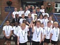 KS2 children with their Cross Country trophy and for individual medals