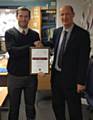 Headteacher, Mr Bridson, presenting the award to Mr Campbell, Head of Sixth Form 