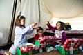 Christmas shoeboxes bring smiles to youngsters in a refugee camp last year