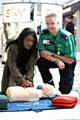 Antoinette Mupeta getting some liffe saving tips from Laurence Brennand of St John Ambulance