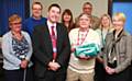 Retiring site supervisor Paul Topping with Whitworth Community High School governors receiving presents from Deputy Head Teacher Philip Donoghue