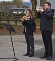 Mr Turner and Y11 student Elisa Iannidinardi in playing The Last Post whilst the school observed a minute silence