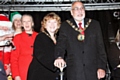 Mayor Surinder Biant and Mayoress Cecile Biant switch the Christmas lights on watched by Liz McInnes MP