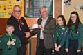 Past President of The Rotary Club of Rochdale East, Len Albon presenting a cheque for £400 to Group Scout Leader, Mike Phillips