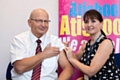 Chairman John Schofield with immuniser Laura Birch