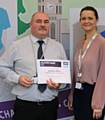 Employee volunteer of the year, Graham Dures, receives his award from RBH Head of Community Investment, Sarah Robinson