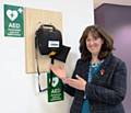 Andrea Fallon, Director of Public Health with a defibrillator at Number 1 Riverside in Rochdale