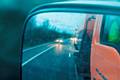 Car using the hard shoulder to undertake a gritter