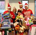 Giving Back Charity Members Michael McCann, Helen Leach, Sue Milne, Dan Swann and Mark Jones prepare to sort some of the 1,300 gifts ready for delivery