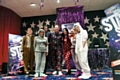 Lisa Watts, June Kay, Nadeam Akthar, Gary Taylor, Kirsty Grimshaw, Karen Mills and Bekka Pollard wearing onesies at Mecca Rochdale