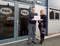 Elaine Mcconnell, Regular Giving Coordinator at Springhill Hospice presenting Tim Fairley, Managing Director at PDS with their Business Buddies Certificate