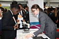 Student speaks to a Source BioScience representative about careers in science a the Rochdale Skills Event