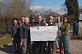 Tony Gardner from The Rotary Club of Middleton (centre) with the The Croft Community Garden Society 