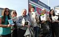 Library staff at Rochdale Train Station on their way to distribute paperbacks to commuters, promoting World Book Night