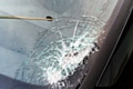 Father and son have lucky escape after stones thrown from motorway bridge smash car windscreen