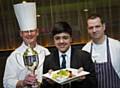 Judges Hopwood Hall College lecturer Brian Yates (left) and Sam Everett from Harvey Nichols (right) with  junior master chef winner Zayn Janghir (centre)