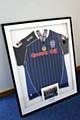 Signed Rochdale shirt and medal