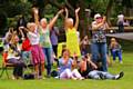 Families enjoy an afternoon’s entertainment in Queens Park