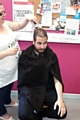 Mauricio Burgazzoli having his head shaved for charity