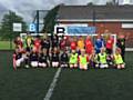 Hopwood Hall College’s community football under-8 players with Pennines Juniors FC.