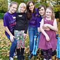 CEO of Caudwell Children, Trudi Beswick (centre), with volunteers and participants on the charity's Summer Activity Club in Rochdale in August