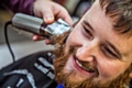 Phil Jordan having his beard shaved for charity