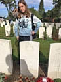 Brooke Strudwick at the grave of Valentine Strudwick at the Tyne Cot War Graves Cemetery