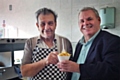 Ken Pashi serves up his last lot of chips to Councillor Richard Farnell before the big move