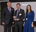 David Ives, Transport for Greater Manchester Fleet Manager, (centre) receives the Local Authority and Public Sector Air Quality Initiative of the Year award from Steve Eminton, Editor of AirQualityNews.com, and Donna Lyndsay, Commercial Director, EarthSense