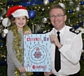 Last year's Christmas Card winner Eve Harrop with Chief Constable Ian Hopkins