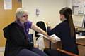 Julie Emerson Technical Instructor with the Children’s Occupational Therapy Team, receiving her flu vaccine