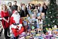 Helen Leach (left) with staff at Swansway Honda in Rochdale, who donated gifts to last year’s toy appeal and will be supporting the appeal again this Christmas