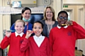 St Mary's year 6 pupils Grace Royal, Mischa Eaton & Edwin Otasowe with dentist Bernie Lackey (back left) & deputy headteacher Kay Whitfield (back right)