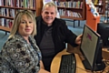 Balderstone and Kirkholt Councillor Richard Farnell and librarian Justine Bull try out one of the new computers