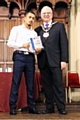 Farmanullah Nawrozy is presented with his award by Mayor Ray Dutton