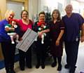 Clinical Engagement Manager and grandma Libby Woodcock holding baby Lilly Worrall; Consultant Neonatologist Natasha Maddock; mum Lauren Flight holding baby Millie Worrall; Sister Caroline Looby and Health Care Assistant James Antrobus