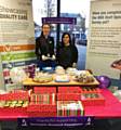 Cake bake at Dr Hamid's Practice with Office Manager Helena Lees next to Practice Manager Sahda Ali