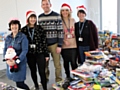 Giving Back charity members Sue Milne, Caroline Wolfenden, Mark Jones, Helen Leach and Lisa Mills ready to sort some of the gifts ready for delivery