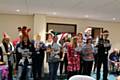 RBH employees entertaining tenants with carols, mulled wine and mince pies