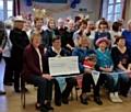 Just For Fun line dancing group present a cheque for £1,000 to the RSPCA Rochdale branch